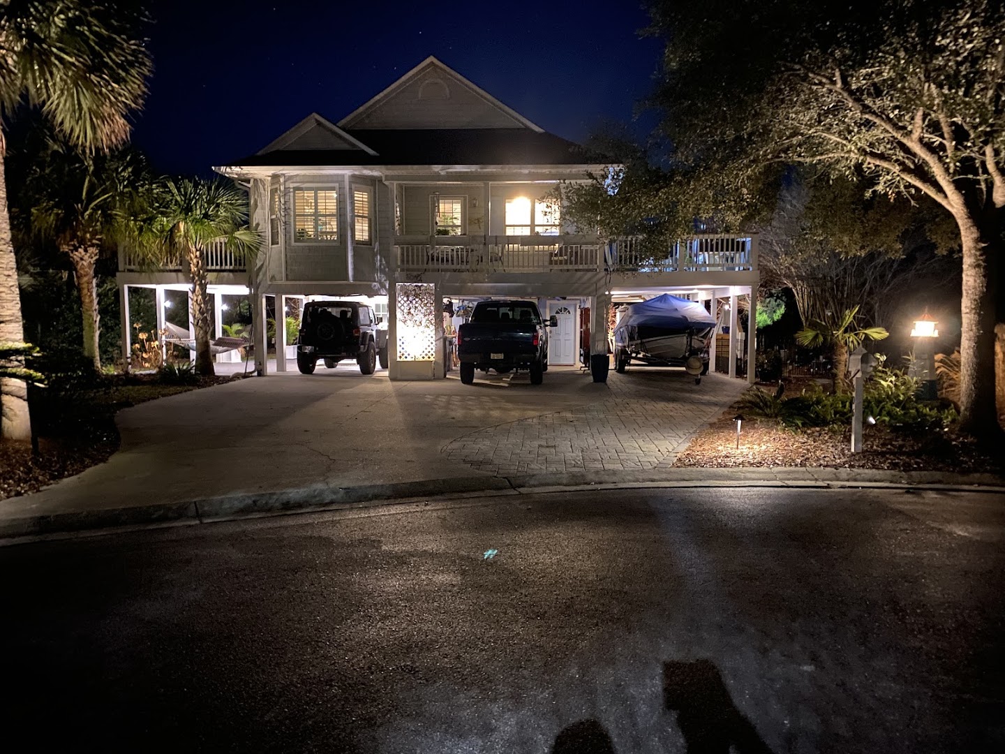 Landscape lighting on a home at night, Wilmington NC