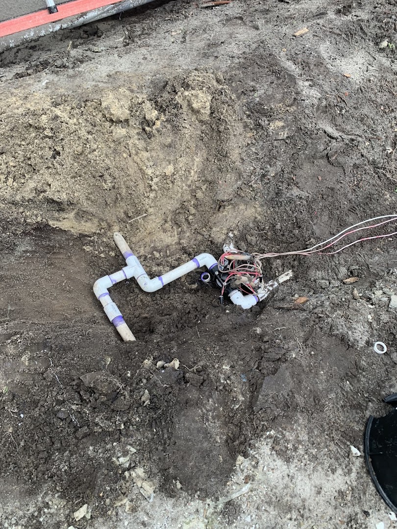 Sprinkler head installed in a mulched planting bed, Wilmington NC